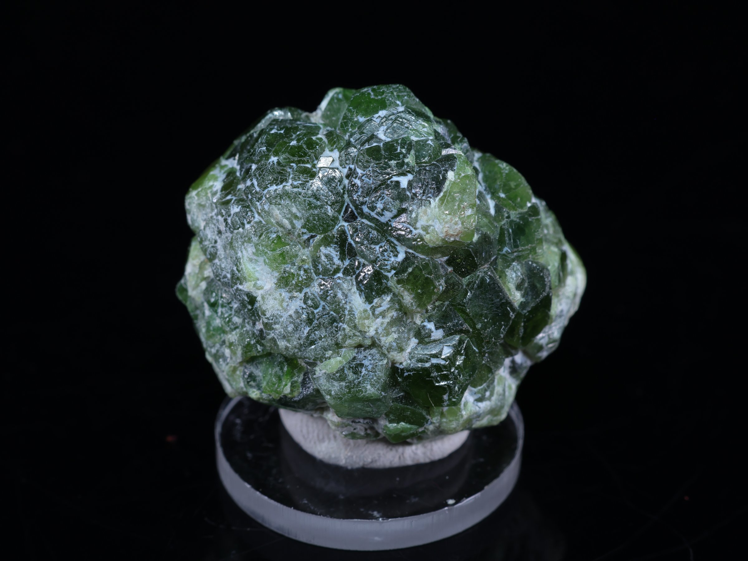 Olive-green peridot crystals on rock from Sapat in Pakistan